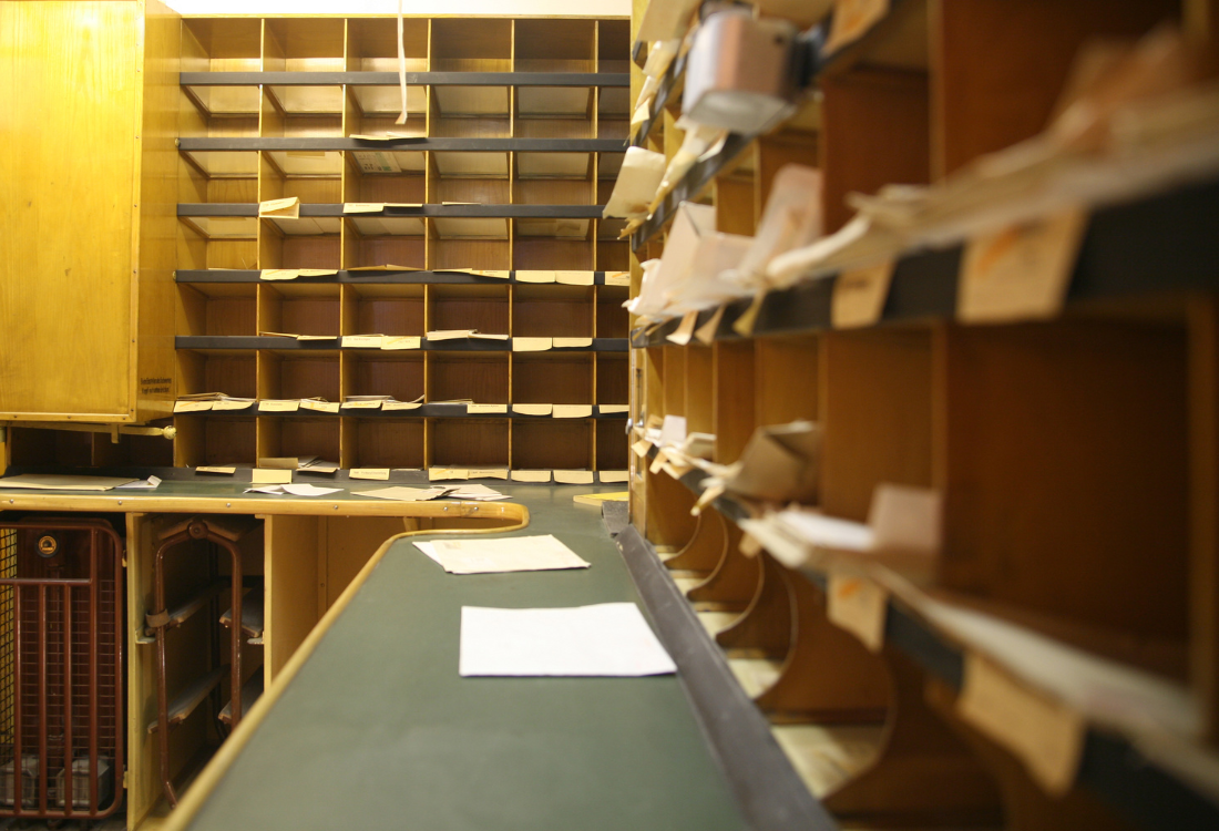 A mailroom management system where mail is sorted and processed after being processed digitally.