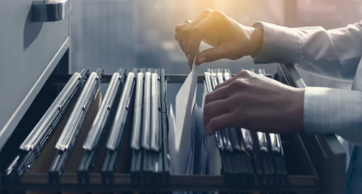 A person using an old document archiving system